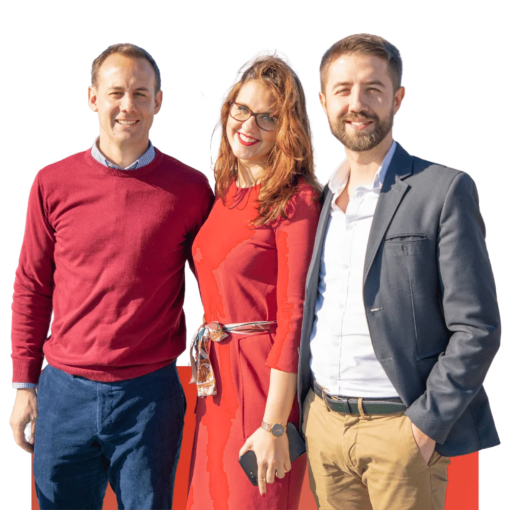 Three colleagues smiling at an event